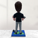 Individuelle Wackelkopffigur mit Laptop und Hantel