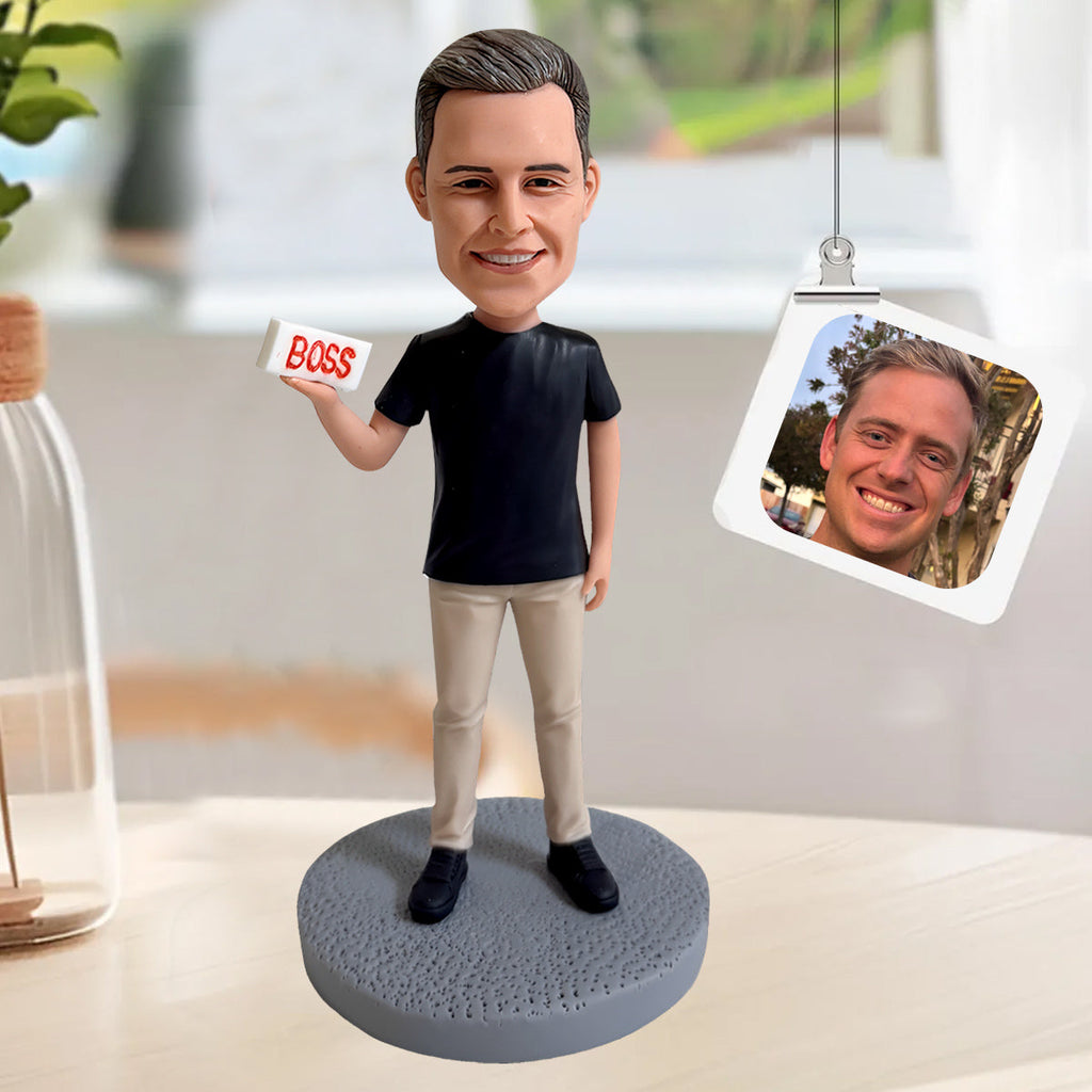 Benutzerdefinierte männliche Wackelkopffigur mit BOSS-Schild